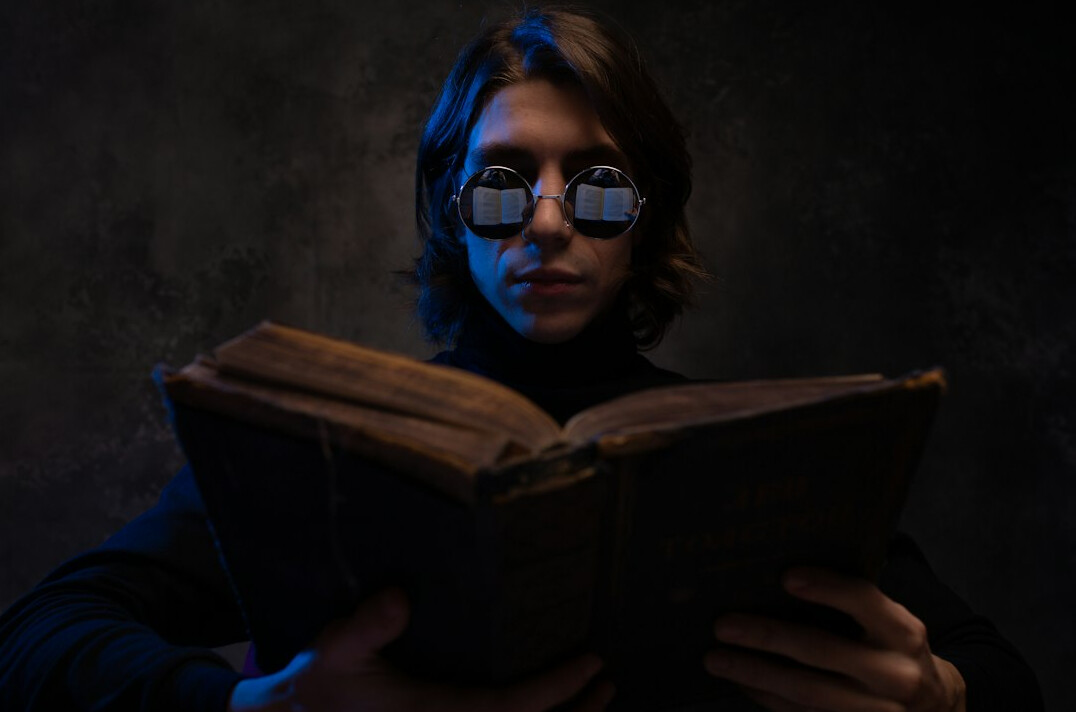 surprised reader holding mystery book