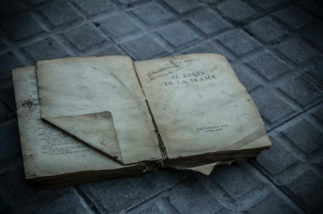 detective reading old book